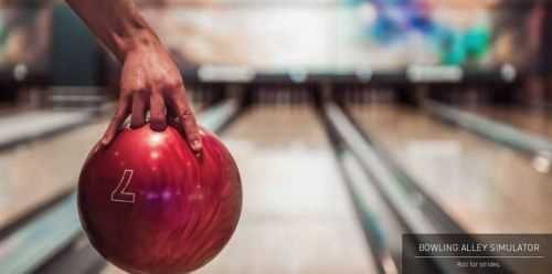 Hand holding a bowling ball in a bowling alley simulator at Signature Global Titanium, Sector 71, Gurgaon.