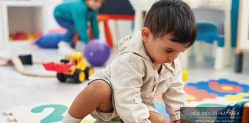 Kid enjoying playtime with toys in playroom at Signature Global Titanium Sector 71 Gurgoan.